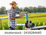 Small photo of Embracing modern innovation, farmers adeptly manage their rice fields with the precision of technology,employing advanced tools and techniques to optimize irrigation, monitor crop health.