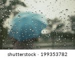 Water drop and blurred umbrella 