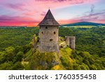 Ruins of a medieval castle Somoska on borders of Slovakia and Hungary at sunset time. Southern Slovakia