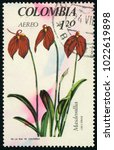 Small photo of COLOMBIA - CIRCA 1967: post stamp printed in Colombia shows three red Masdevallia coccinea flowers on white background; orchids series; Scott C490 A327 1.20p green red; circa 1967