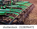 Small photo of Versatile cultivator with disk, cultivate, harrow tools for secondary tillage - agricultural preparation of soil by mechanical agitation of various types, such as digging, stirring, and overturning.