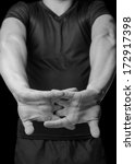 Small photo of Man unbend fingers, black and white image