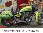 Small photo of Fairfield, CA - September 3, 2022: Lime green Victory Kingpin motorcycle on display inside a Jelly Belly store.