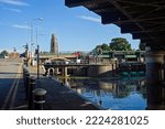 Small photo of View from under the grand sluice bridge on Witham bank with the stump tower in the distance. BOSTON Lincolnshire UK Aug 2022