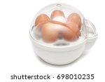 Small photo of Boiled eggs with egg boiler on white background