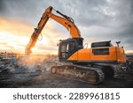 Small photo of Excavator with concrete crusher at demolition site