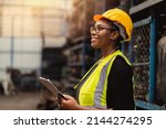 Happy Black African women engineer worker enjoy working in factory industry.