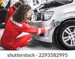Small photo of Mechanic garage auto workshop team working service repair fix damaged front bumper accident car