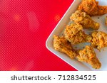 kentucky style fried chicken on red background with space for text
