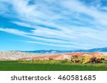 Landscape featuring tractors and an airplane boneyard in Greybull, Wyoming