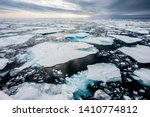 Dramatic wide angle view of melting  arctic sea ice floes breaking up taken at sea.Climate Crisis and Breakdown.Climate Emergency- Image