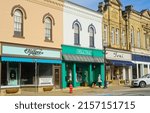 Small photo of CHAGRIN FALLS, OH, USA - APRIL 30, 2022: Shops and quaint facades line the business district of this charming village in NE Ohio on a bright morning before the start of business.