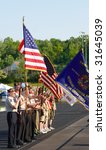 Small photo of TWINSBURG, OH - June 5: A color guard stands at attention at the beginning of Relay for Life, an annual fundraising event sponsored by the American Cancer Society, June 5, 2009, in Twinsburg, Ohio.