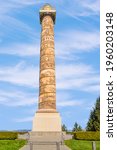 Small photo of Astoria, Oregon - April 14, 2021: Dedicated by the Great Northern Railway in 1926, the Astoria Column is a tower in the northwest United States, overlooking the Columbia River on Coxcomb Hill.