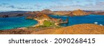 Small photo of Galapagos islands travel banner. Bartolome Island, volcanic islet in the Islas Galapagos archipelago. Panoramic view of Sullivan bay, golden beach and Santiago island from hiking on cruise excursion.