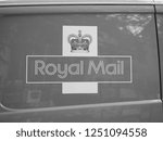 Small photo of CAMBRIDGE, UK - CIRCA OCTOBER 2018: Sign on red Royal Mail van in black and white