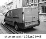 Small photo of CAMBRIDGE, UK - CIRCA OCTOBER 2018: Red Royal Mail van in black and white