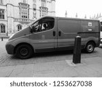 Small photo of CAMBRIDGE, UK - CIRCA OCTOBER 2018: Red Royal Mail van in black and white