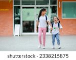 Little kid girl asian with a backpack going to school with fun. which increases the development and enhances the learning skills. Concept Back to school.
