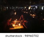 Small photo of KUALA LUMPUR,MALAYSIA-MARCH 31:Unidentified Malaysian families experience Earth Hour 2012 while having satay dinner in K. Lumpur on Mar 31 2012.The event is held annually on the last Saturday of March