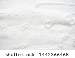 Abstract background white soapy foam texture. Shampoo foam with bubbles