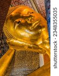 Small photo of BANGKOK, THAILAND - FEBRUARY 5, 2023 Face Reclining Buddha Wat Phra Chetuphon Wat Pho Po Temple Bangkok Thailand. Buddha's face entrance to heaven nirvana. Temple built 1600s. Reclining Buddha 1832