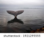 Landmark of Fabborg in Denmark - The whale tale in the ferry port with the opposite islands in the background