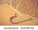 Heart Drawn On The Beach Sand...