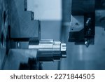 The  CNC lathe machine forming  cutting the metal shaft parts. The hi-technology metal working processing by CNC turning machine .