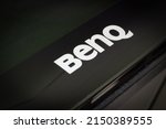 Small photo of Sochi, Russia - April 21, 2022: Benq brand name text on a black plastic front panel of an TV or display panel.