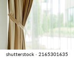 Small photo of soft brown curtain sheer with morning light from window bedroom background banner header size image home interior design detail concept background