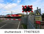 Train Passing Red Lights At An...