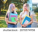 young cheerful student girls... | Shutterstock . vector #2070574958
