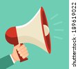 Promotion and advertising concept - icon in flat style. Male hand holding loudspeaker - raster illustration - stock photo